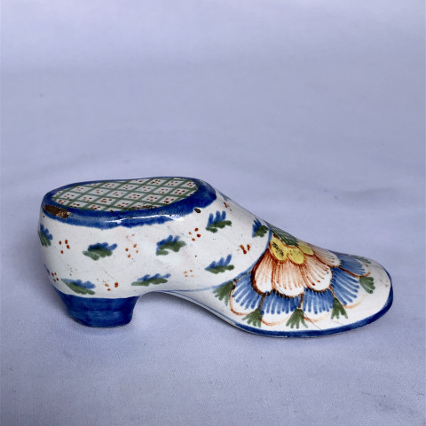Secouette en forme de soulier