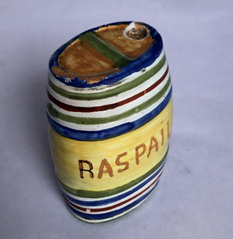 Secouette en forme de tonneau marquée Raspail